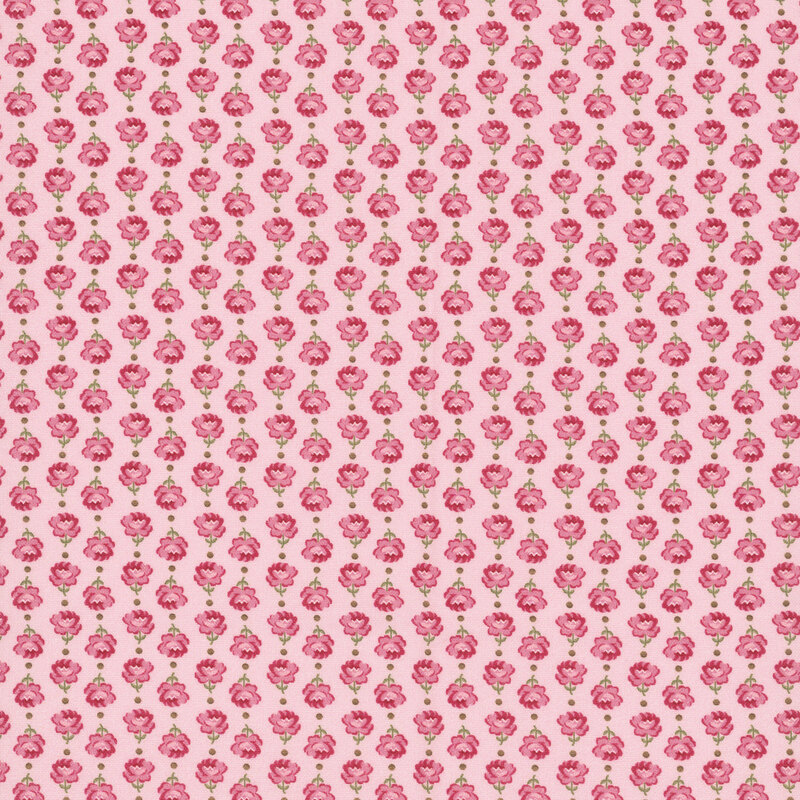 Vertical columns of roses alternating in direction on pink fabric.