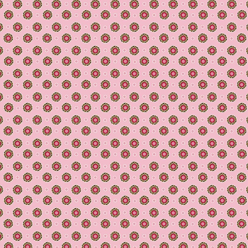 Pink fabric featuring evenly spaced floral medallions and white circle outlines.