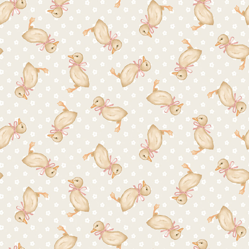 Light greige background with white polka dots and tossed yellow ducklings wearing little pink bows