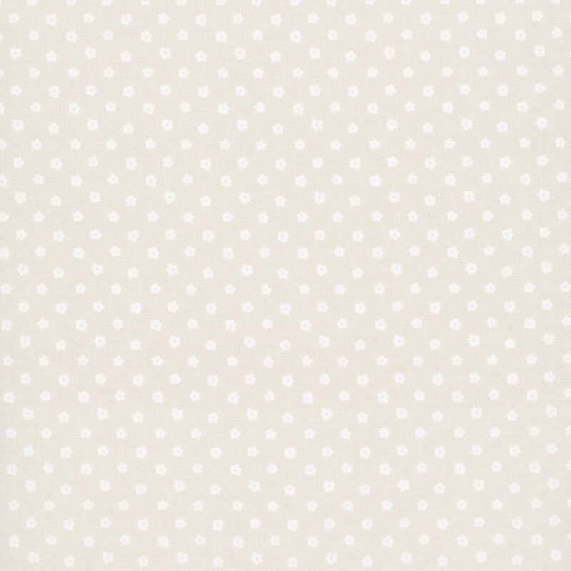Light taupe fabric with cream flower-shaped polka dots