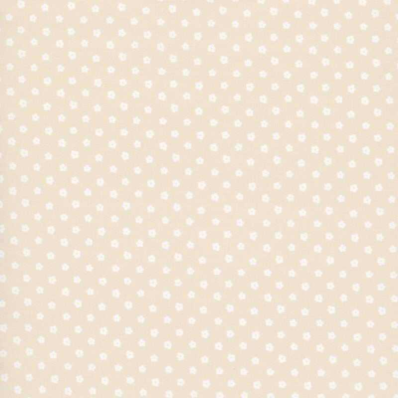 Beige fabric with cream flower-shaped polka dots