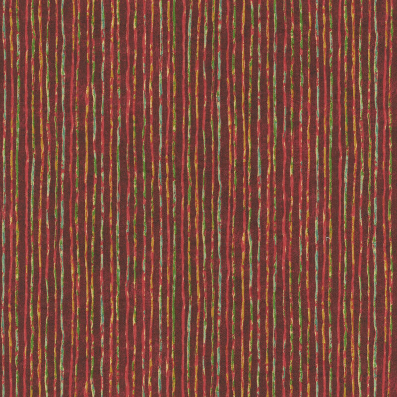 A mottled red fabric with yellow, blue, and green grunge stripes. 