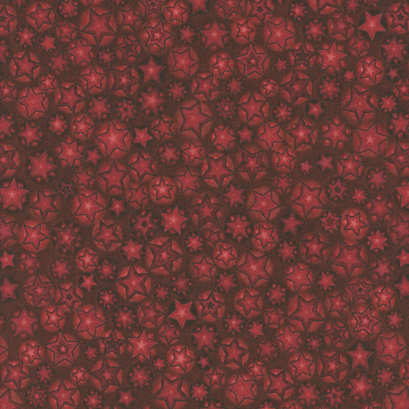 A mottled red fabric with a variety of red stars.