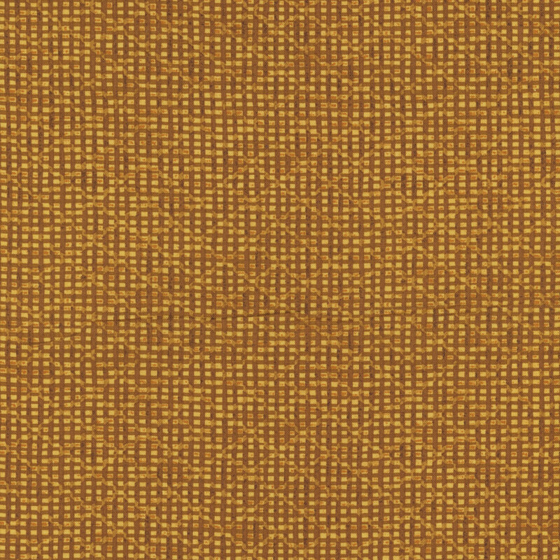 A golden fabric with tonal vertical and horizontal stripes overlaid with a lattice pattern. 