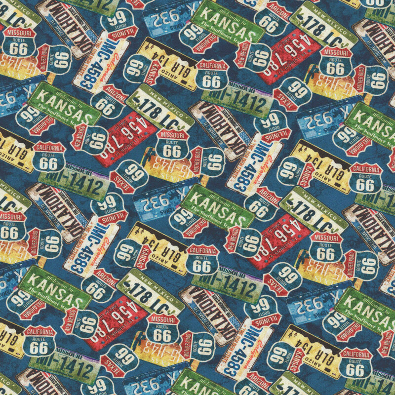 Dense pattern of license plates and highway signs from Route 66 on a textured navy blue background.