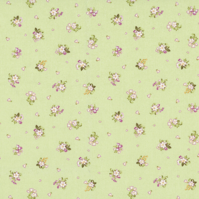 Apple green fabric with a ditsy pattern of small white floral bunches