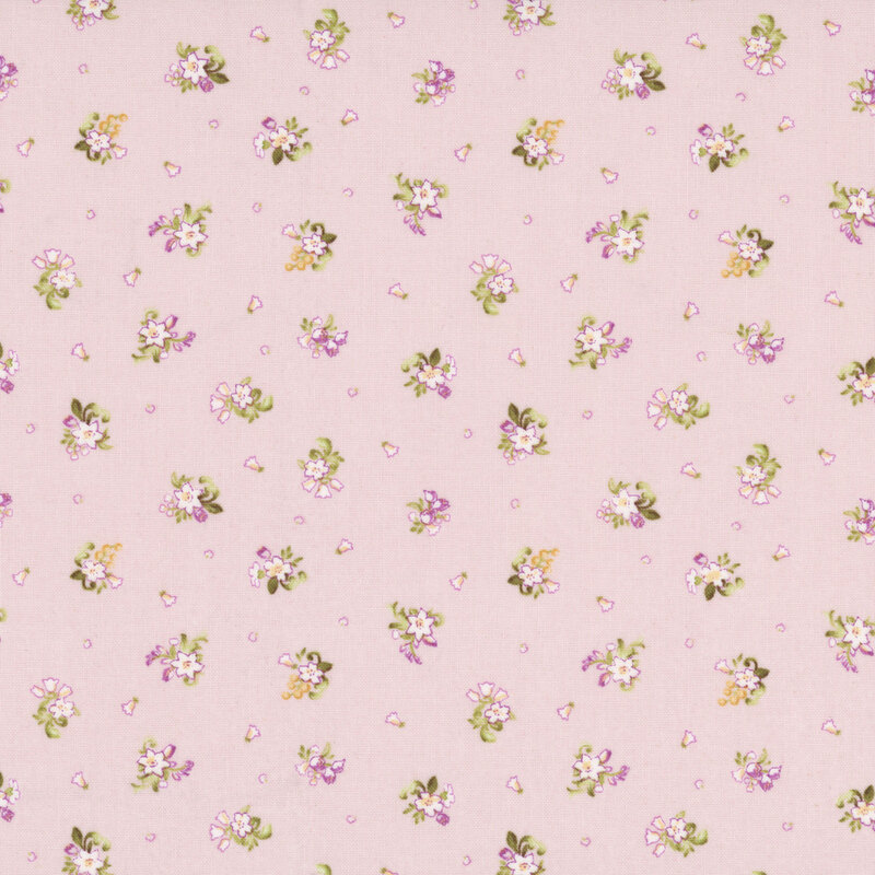 Pale mauve fabric with a ditsy pattern of small white floral bunches