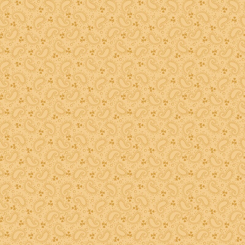 Goldenrod fabric with a gold, dotted boteh and leaf pattern