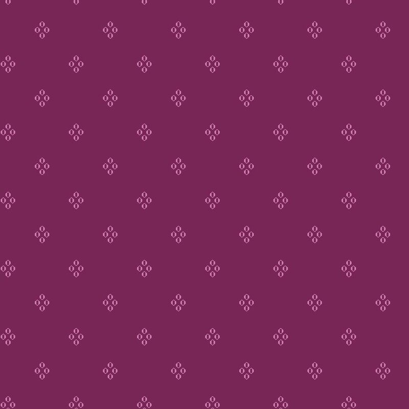 Deep magenta fabric with a pattern of pink diamond shaped circles
