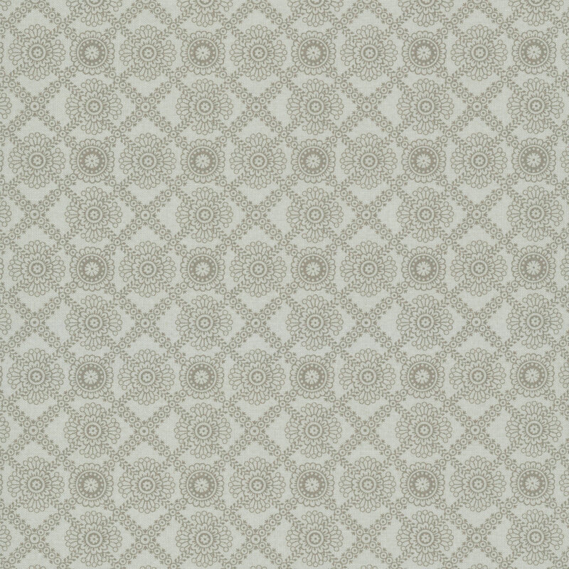 Putty gray fabric with a taupe, primitive lace-inspired design