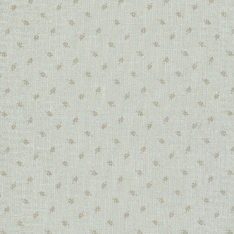 Putty gray fabric with a pattern of ditsy greige leaves