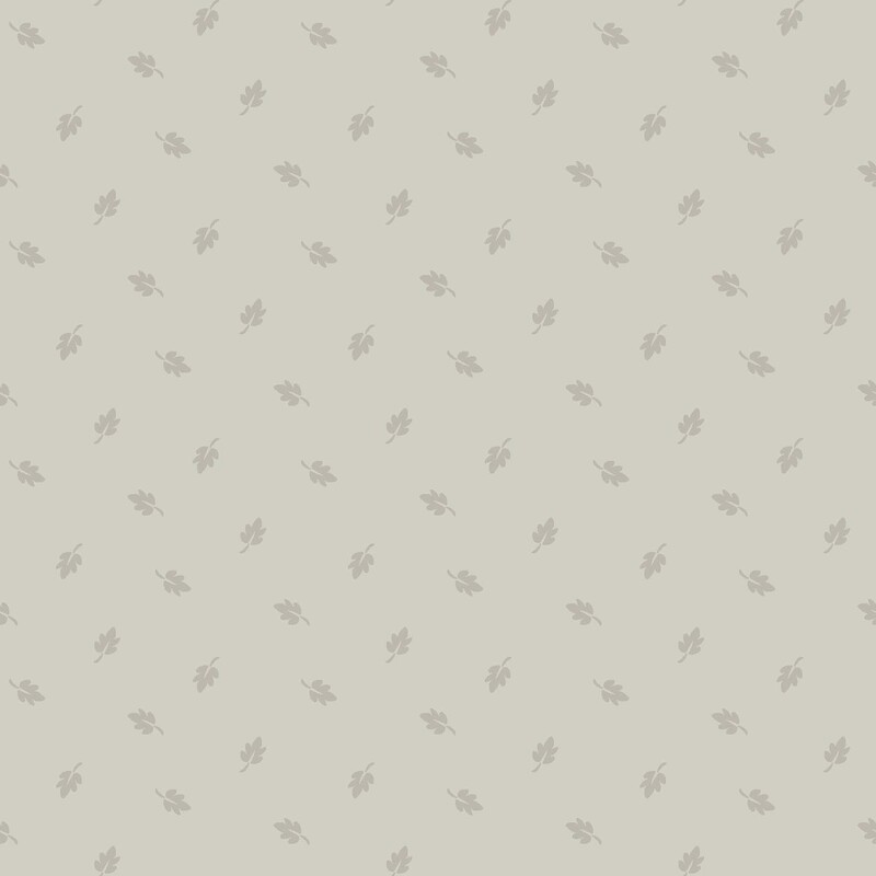 Putty gray fabric with a pattern of ditsy greige leaves