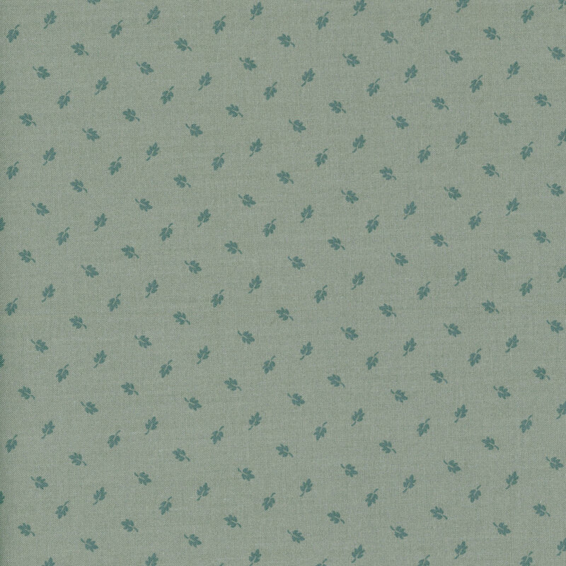 Ash gray fabric with a pattern of ditsy teal leaves