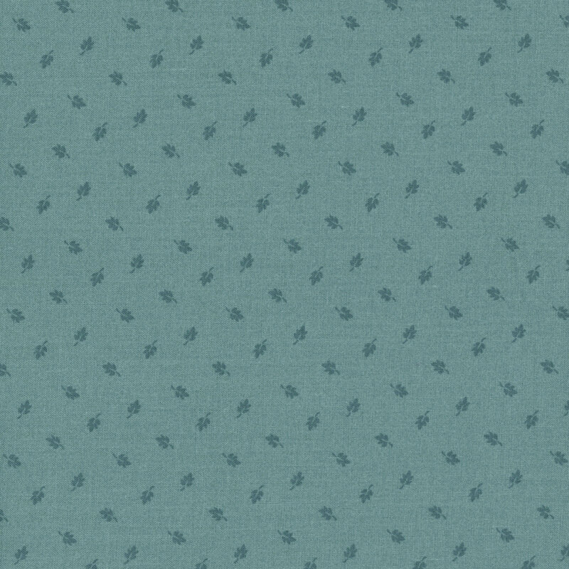Muted turquoise fabric with a pattern of ditsy dark teal leaves