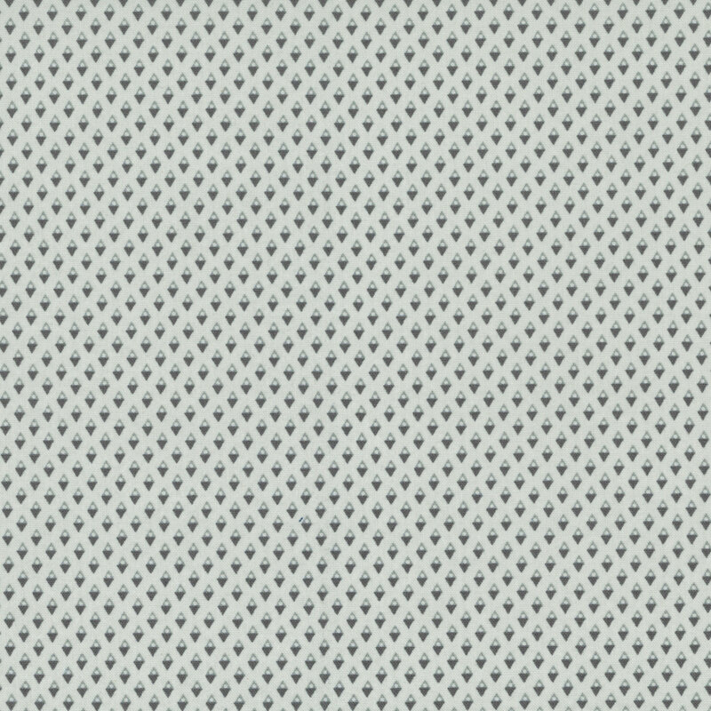 cool cement gray fabric with light and dark gray diamond shapes with light circles