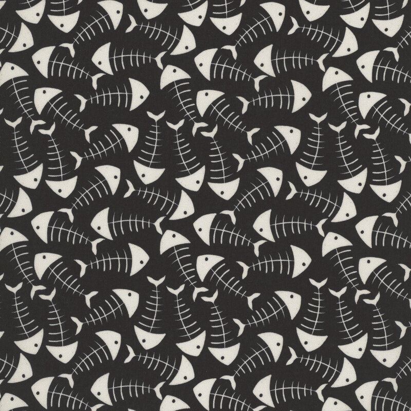 Black fabric covered in white cartoon-style fish bones.