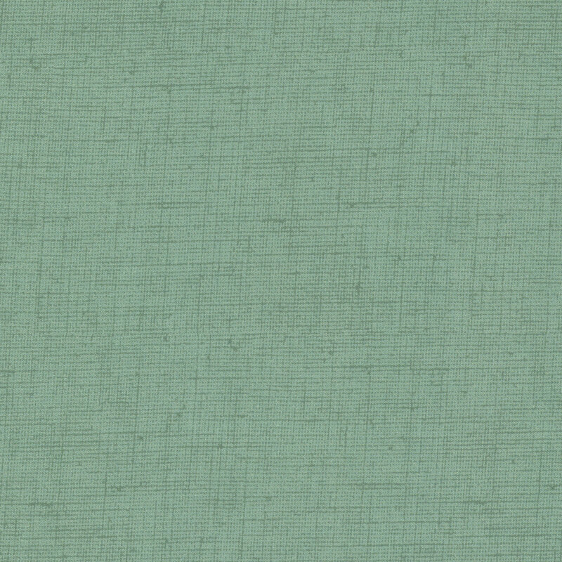 Green fabric with a woven texture.