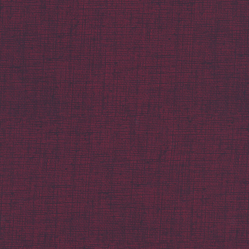 Very dark burgundy fabric with a woven texture.