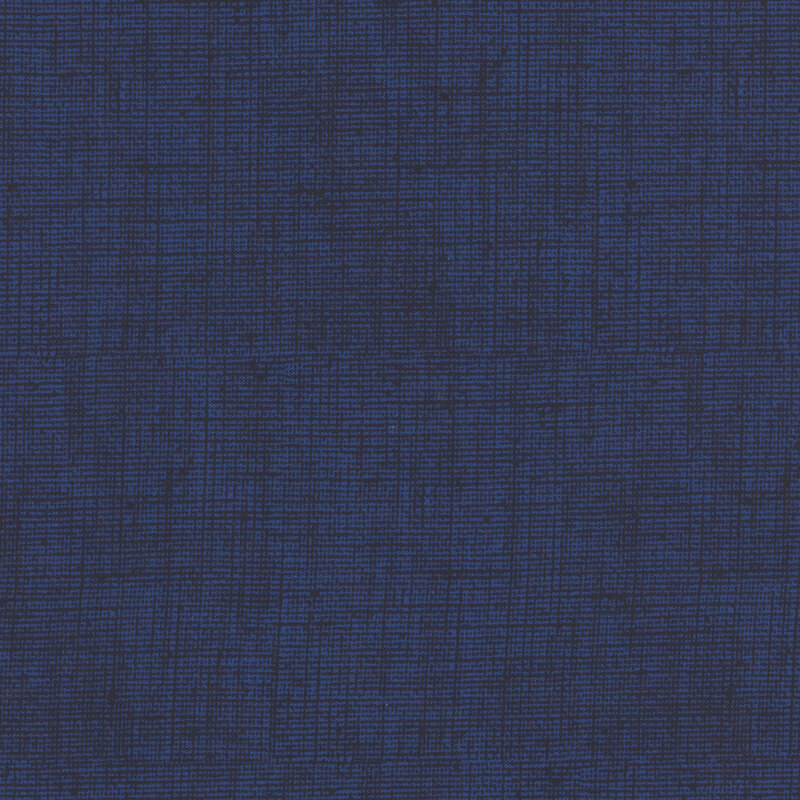 Deep indigo blue fabric with a woven texture.