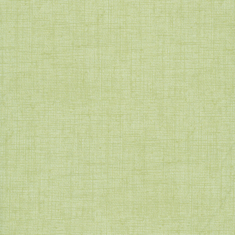 Pear green fabric with a woven texture.