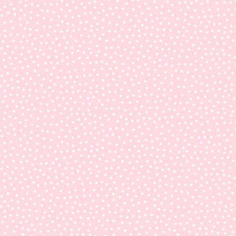 Pastel pink fabric with a pattern of white dots