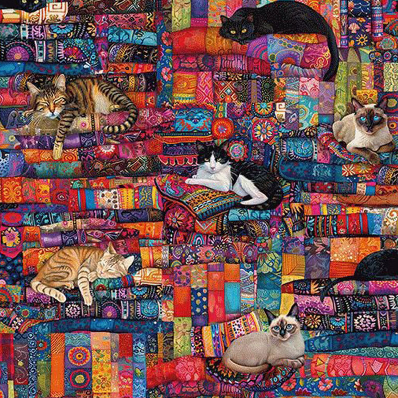 Multicolored fabric featuring layers of brightly colored textiles with sleeping cats.