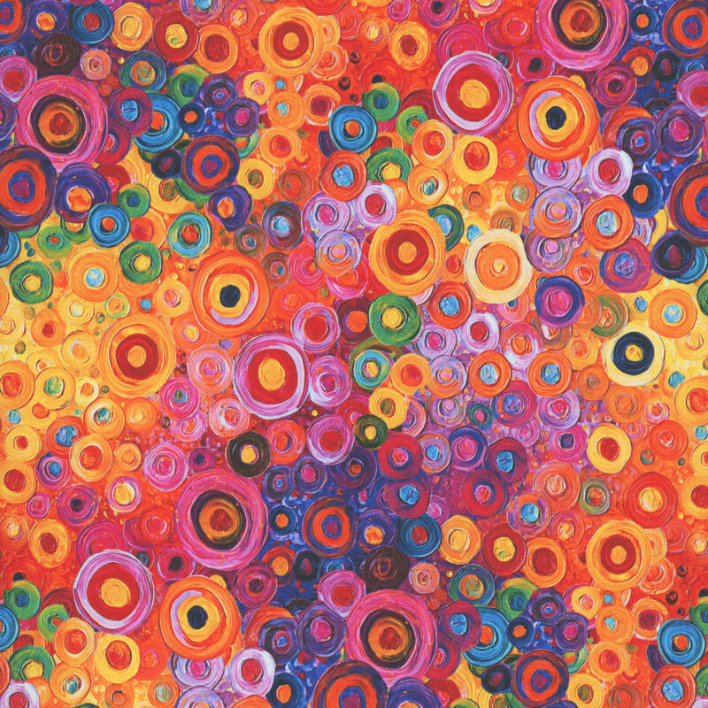 Bright, multicolored fabric with brushstroke circles and dots.