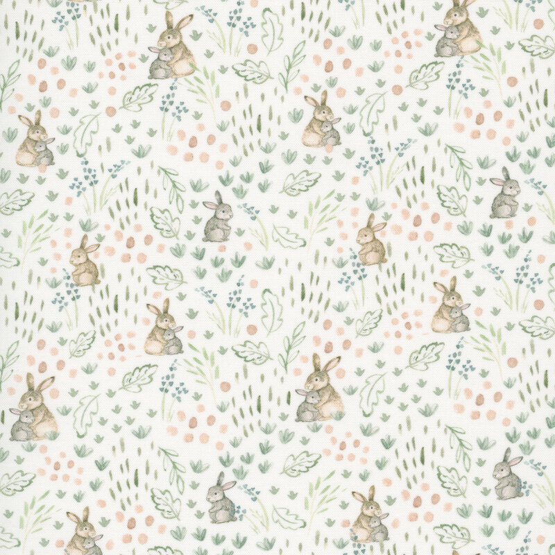 White fabric with a pattern of leaves and stylized bunnies.