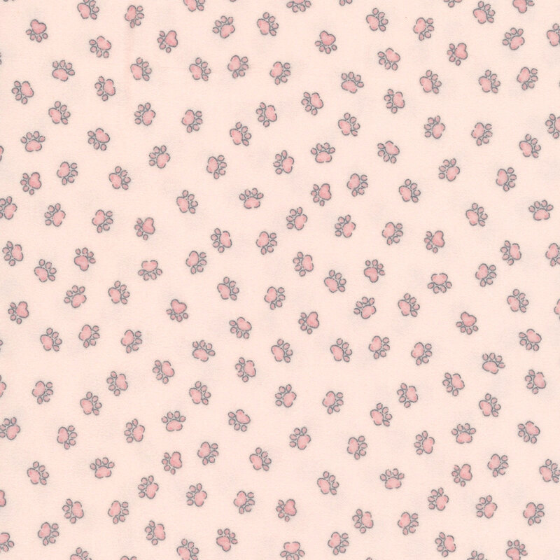 A pastel pink fabric with tossed pink cat paw prints. 