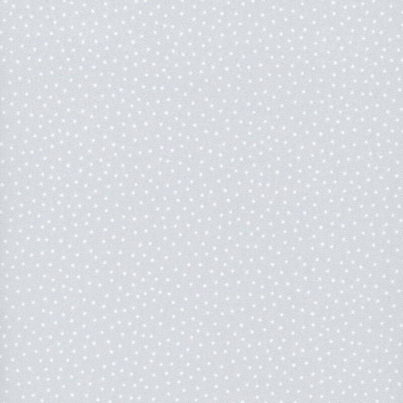 A light gray fabric with tiny white polka dots. 