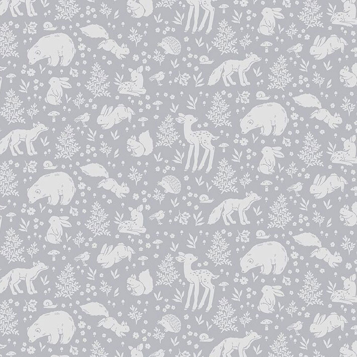 A tonal gray blue fabric with motifs of woodland animals surrounded by flowers, fern leaves, and mushrooms.