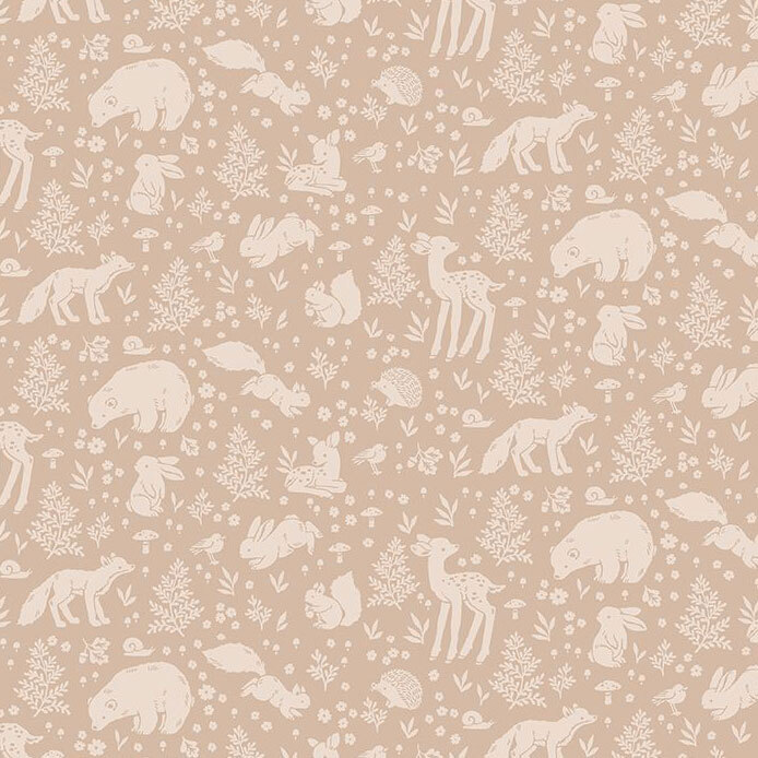 A tonal light brown fabric with motifs of woodland animals surrounded by flowers, fern leaves, and mushrooms.