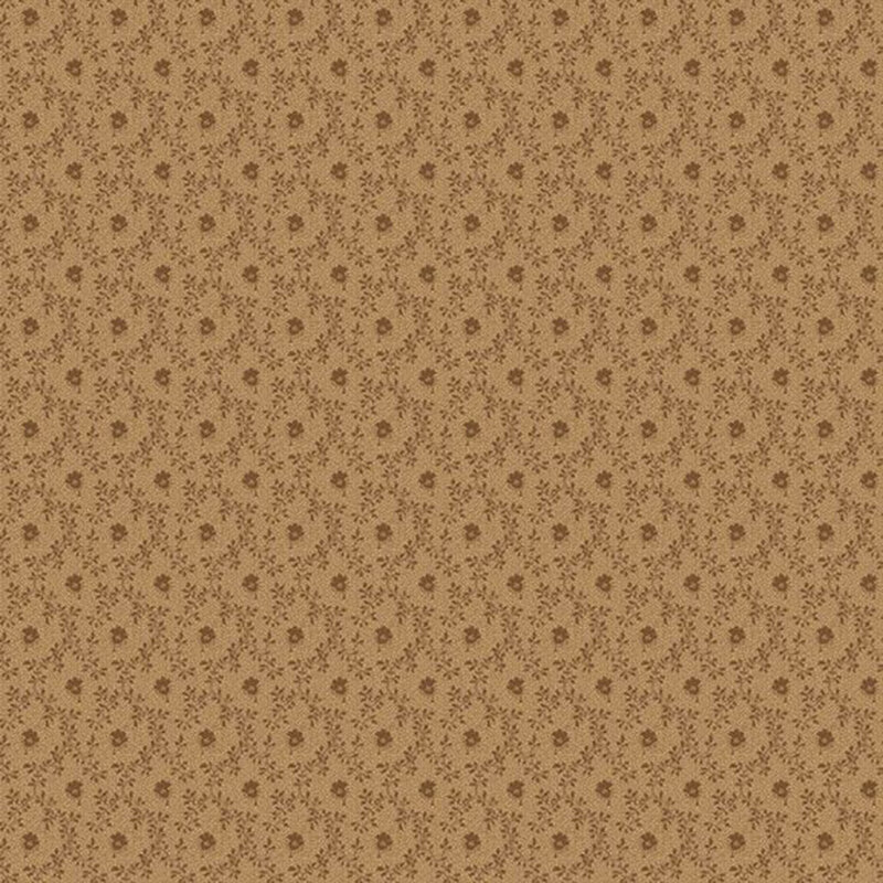 Tonal light brown fabric featuring a small flower inside a vine lattice design.