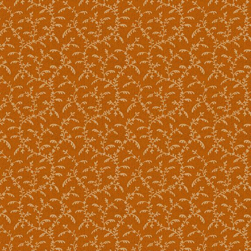 Burnt sienna fabric with orange swirling, leafy vines.