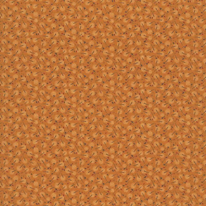 Cinnamon fabric with a calico pattern of maple winged seeds and dandelion puffs.