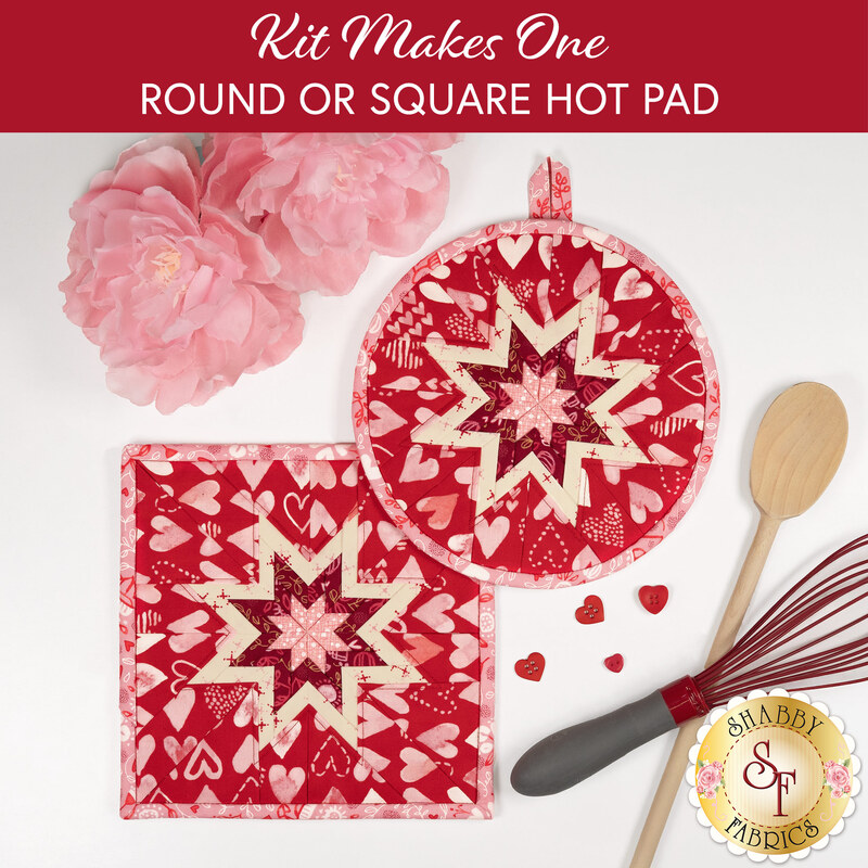 A top down shot of the completed square and circle Hot Pads colored in bold pink, red, and cream fabrics from the Darling Peony collection by Moda Fabrics, staged on a white countertop with coordinating flowers and kitchen utensils.