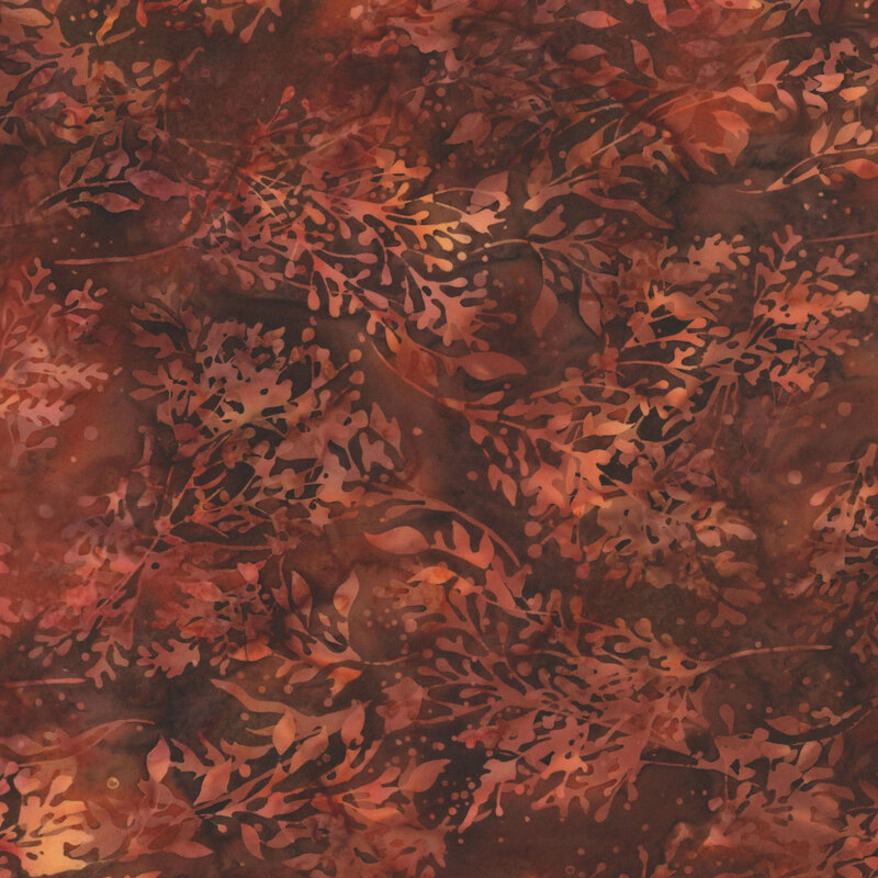 Coffee brown fabric with reddish brown mottling and a tonal overlay of leaves and stems