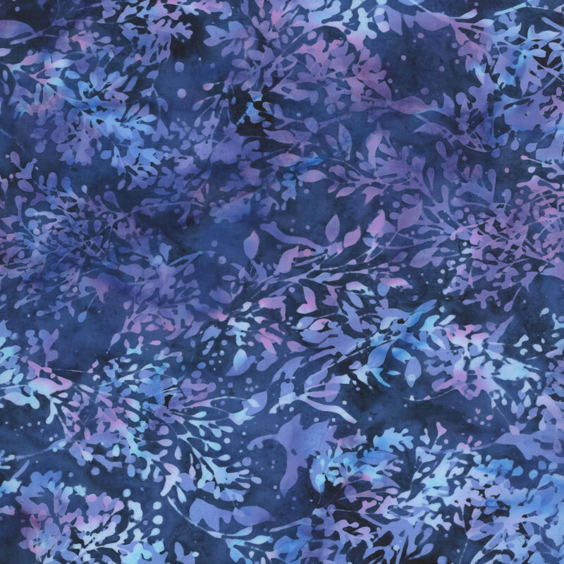 Midnight blue batik fabric featuring leaves in mottled blues and violets.