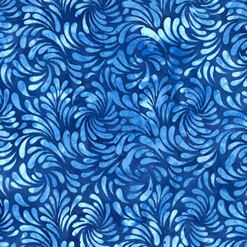 Mottled blue batik fabric featuring a swirling design of brush strokes in mottled hues of ice and denim blue.