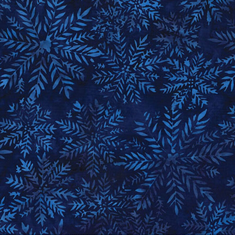 Deep blue batik fabric featuring mottled, lighter blue fern-like bursts.