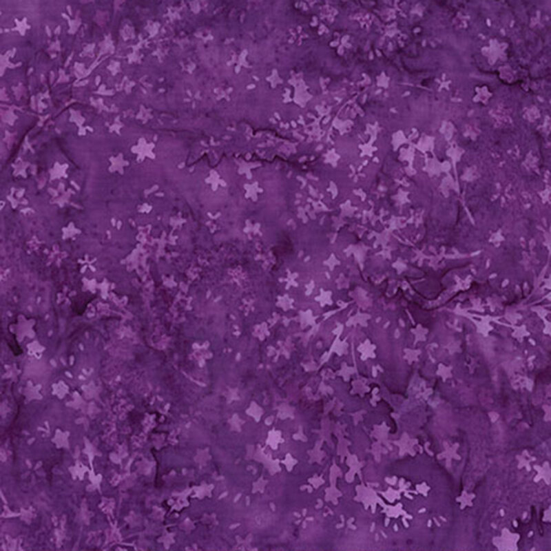 Mottled, deep purple batik fabric featuring flower silhouettes.