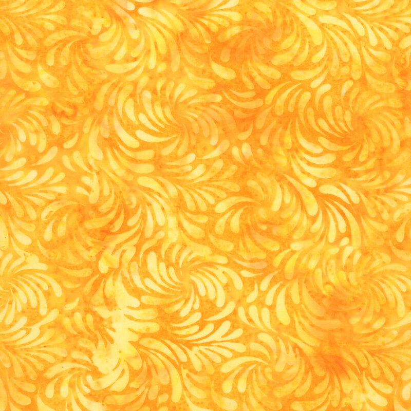 Mottled light orange batik fabric featuring a swirling design of brush strokes in mottled hues of yellow.