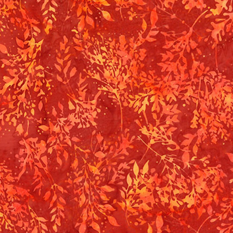 Bright orange batik fabric featuring long stemmed leaves.