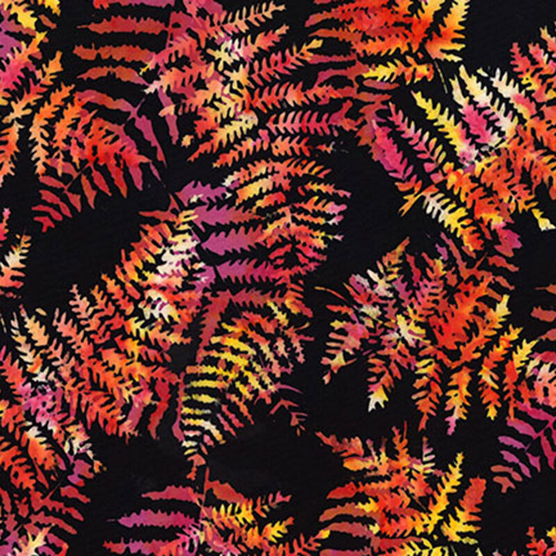Black batik fabric featuring large fern leaves in mottled hues of red, orange, and yellow.