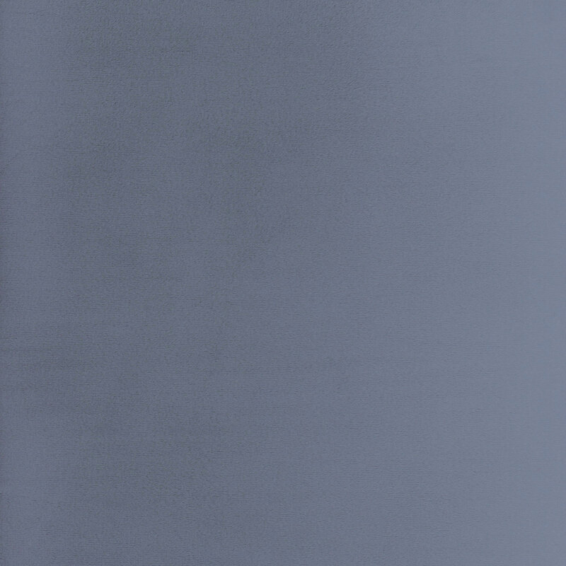 Solid swatch of denim blue Cuddle fabric.