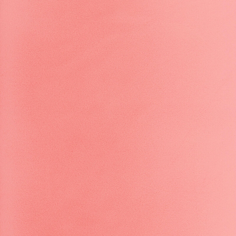 Solid swatch of coral pink Cuddle fabric.