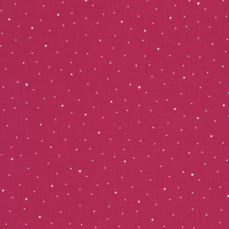 A hot pink fabric with scattered small white dots.