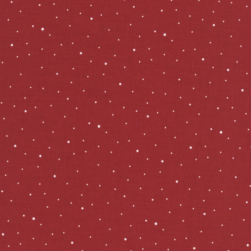 A cranberry red fabric with scattered small white dots.