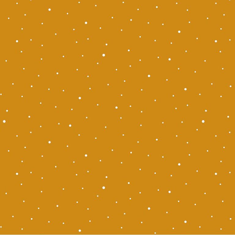 A light orange fabric with scattered small white dots.