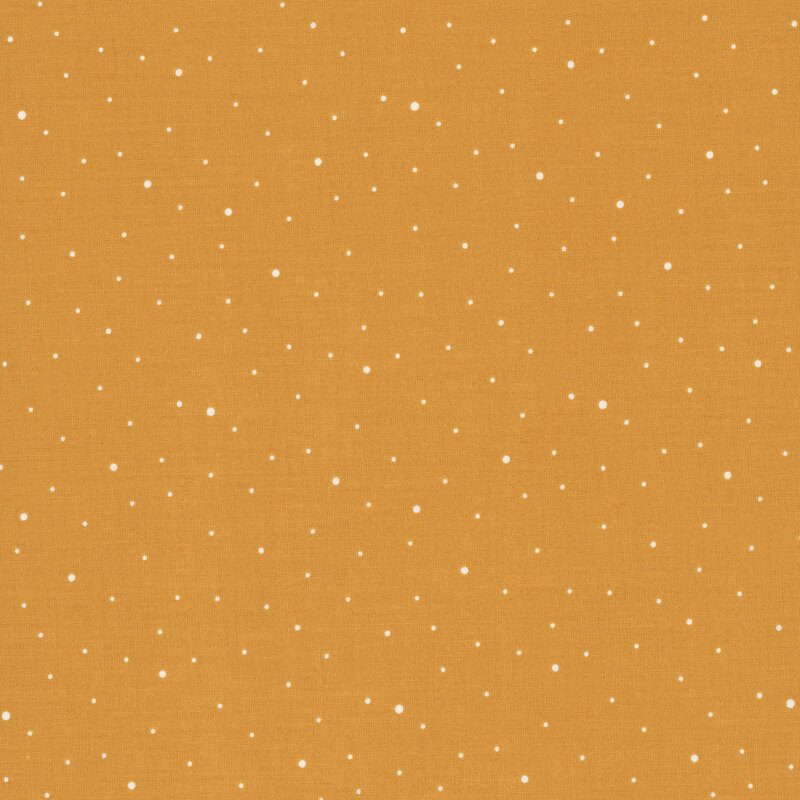 A light orange fabric with scattered small white dots.